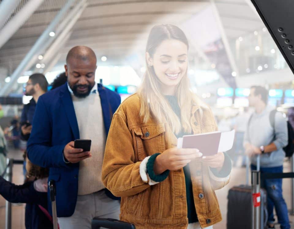 A woman is listening to a directional speaker giving instruction to prepare her passport.